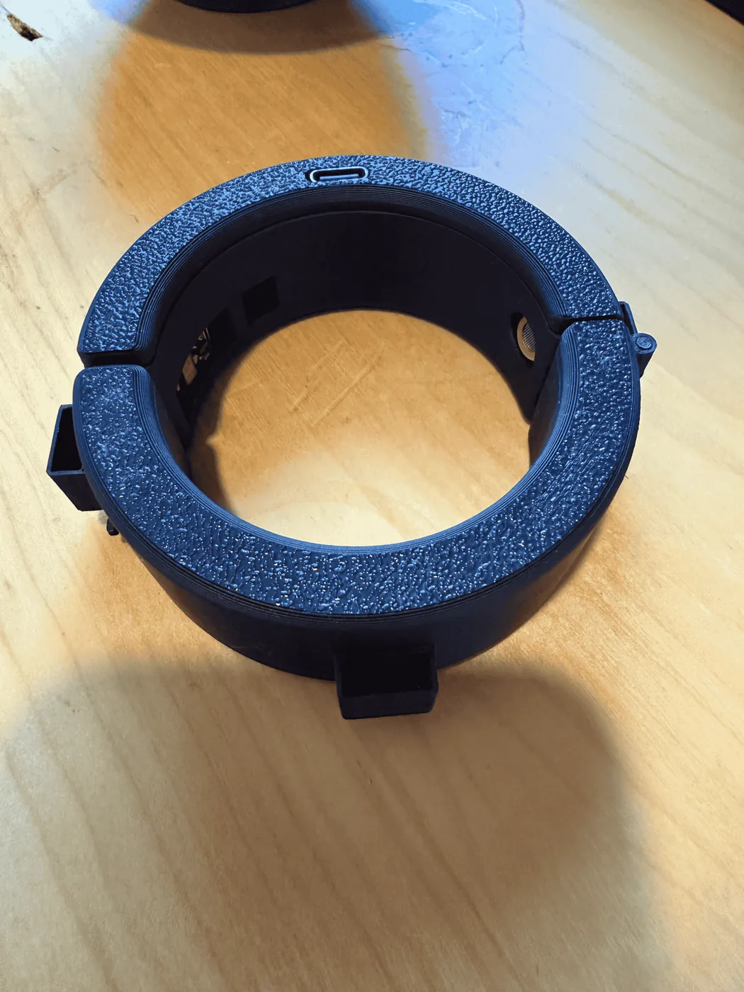 The first working band prototype, a blue 3D-printed ring